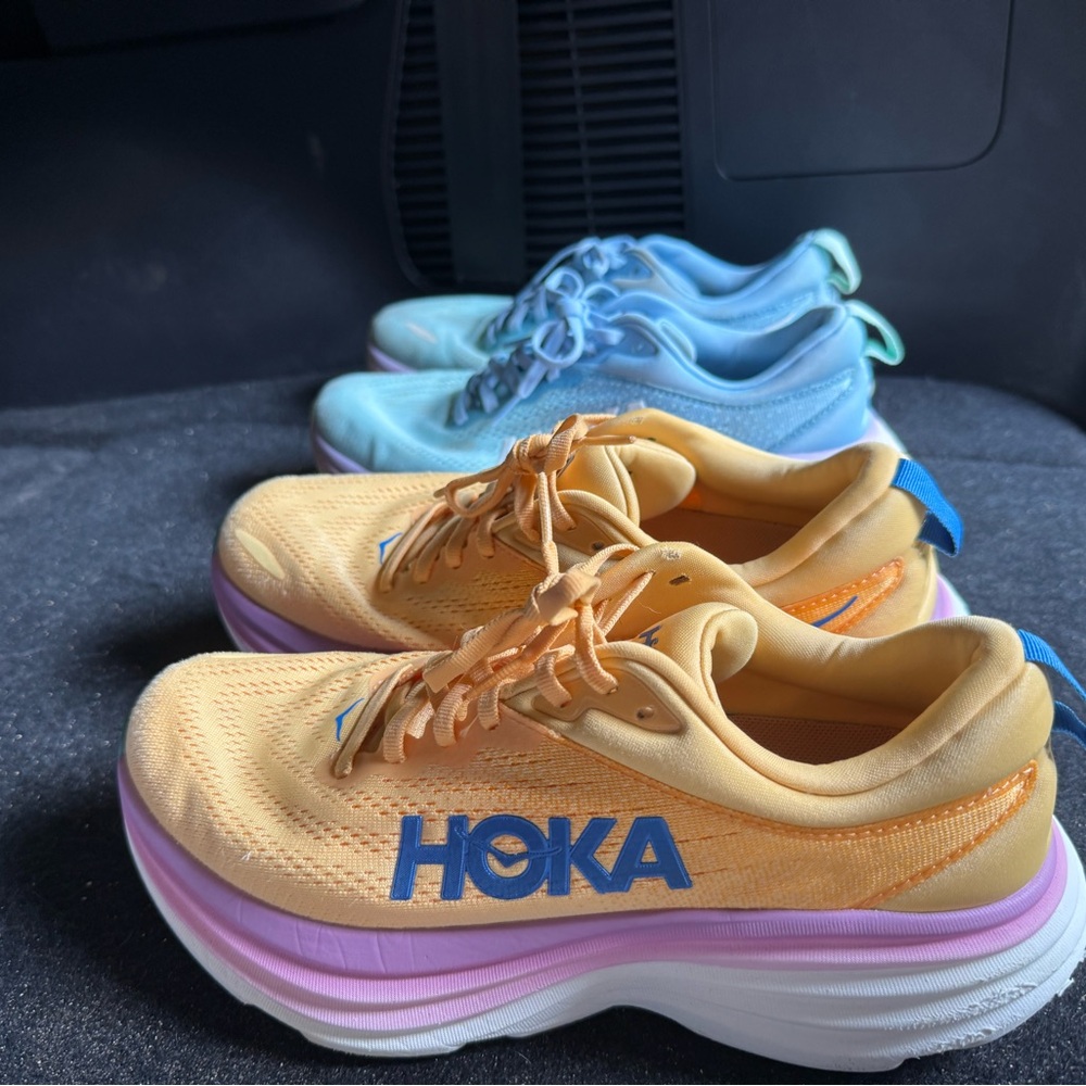 2 pairs of Hoka Bondi 8 running shoes size 9, yellow and blue